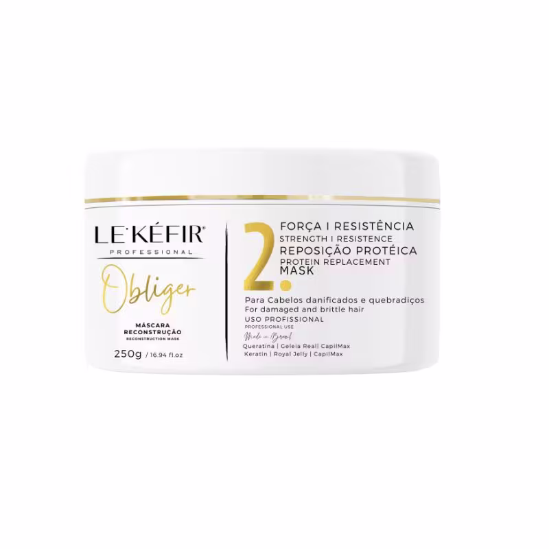 A imagem mostra uma máscara capilar que vem em um pote branco com detalhes em dourado, contendo 250g. O design da embalagem mostra elegância e sofisticação.