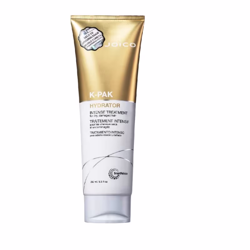 A imagem mostra a embalagem plástica em tubo dourado e branco com a máscara capilar.