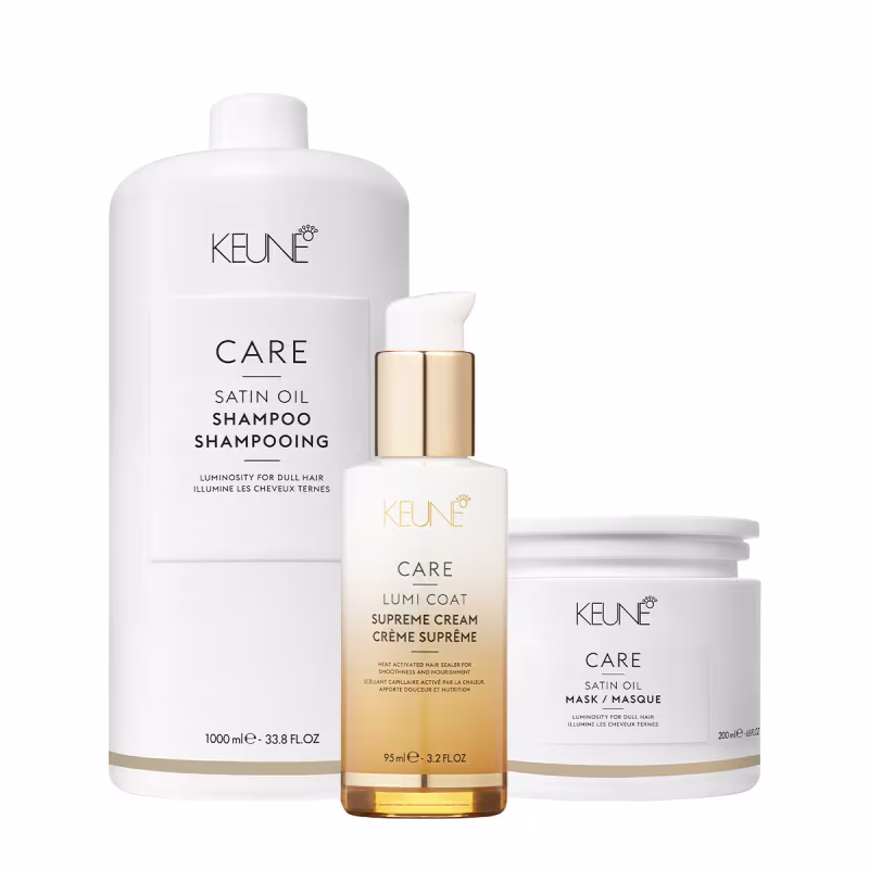 Kit da marca Keune, incluindo shampoo de 1 litro, creme leave-in 95ml e máscara 200ml da linha Satin Oil, com embalagens brancas e douradas.