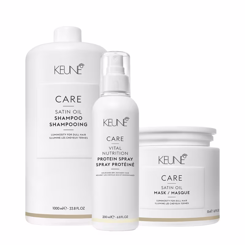 Produtos Keune Care: shampoo Satin Oil, spray de proteína vital nutrition e máscara Satin Oil, em embalagens brancas com detalhes dourados, apresentando informações sobre os benefícios para cabelos opacos e danificados.