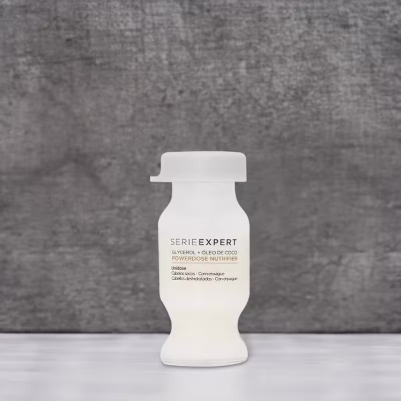 Ampola capilar da linha Serie Expert da L'Oréal Professionnel. O frasco tem um formato cilíndrico com uma tampa achatada na parte superior.