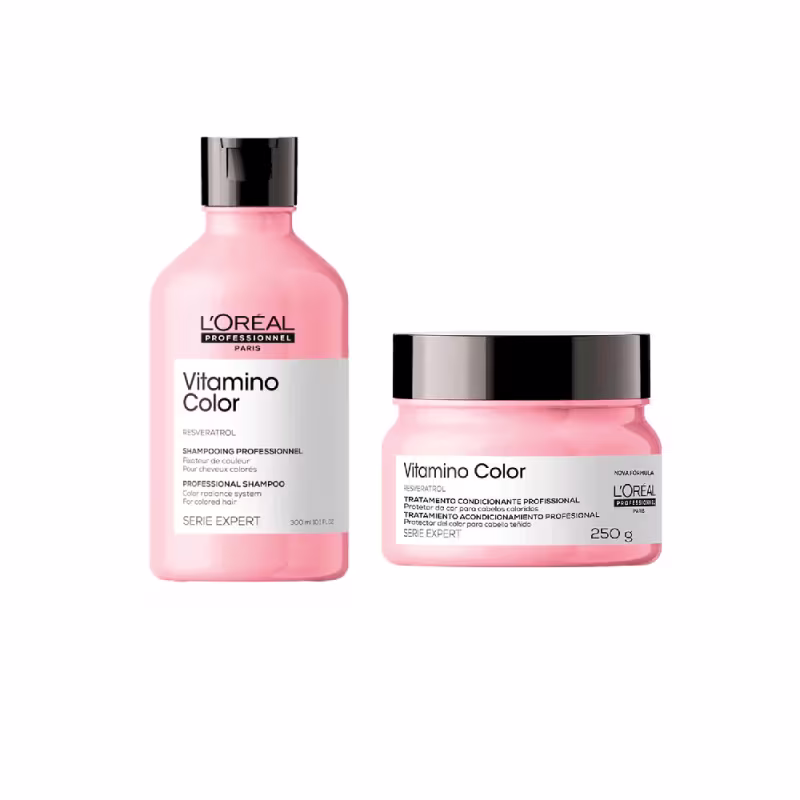 A imagem mostra dois produtos de cuidados capilares da linha Vitamino Color da L'Oréal Professionnel. Um é um shampoo profissional em um frasco plástico rosa de 300 ml. O outro é uma máscara profissional em um pote plástico rosa de 250g.