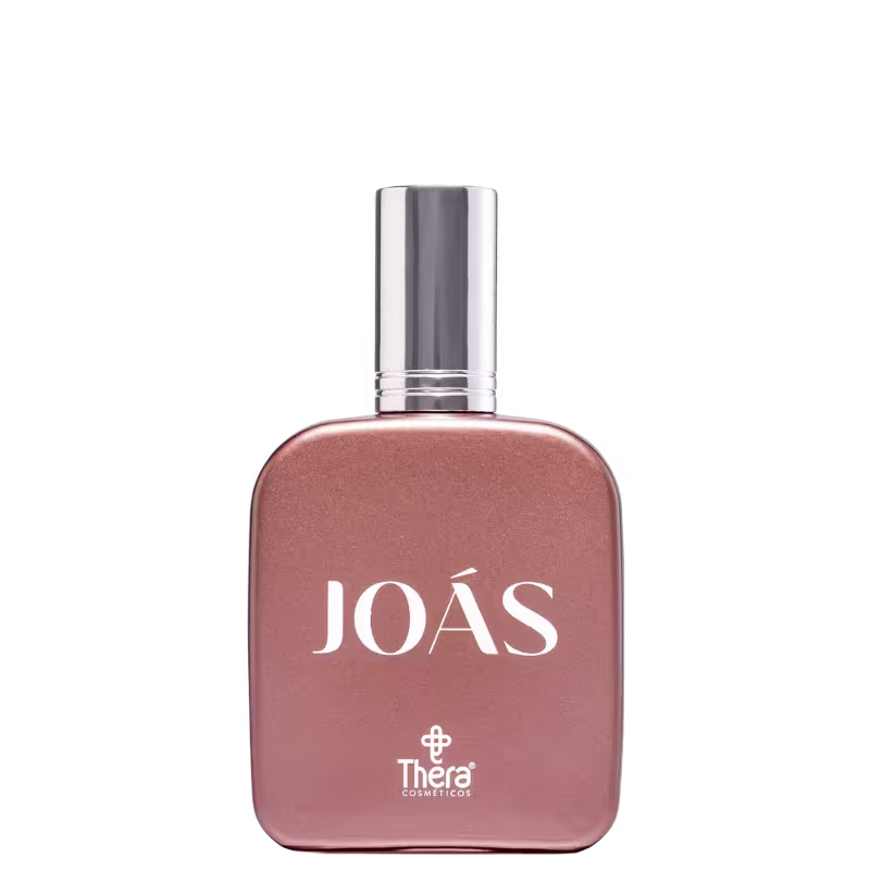 Perfume em frasco retangular na cor rosa com tampa prateada. O frasco tem o nome "JOÀS" em letras brancas maiúsculas, abaixo do qual está o logotipo da marca Thera Cosméticos.