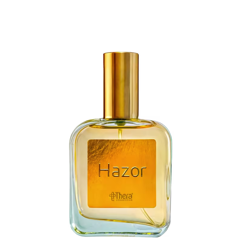 Perfume em frasco de vidro transparente com líquido âmbar. Embalagem com tampa dourada. Rótulo retangular na parte frontal com o nome "Hazor" escrito em letras pretas sobre fundo âmbar. Logotipo da marca Thera Cosméticos visível abaixo do nome do produto.