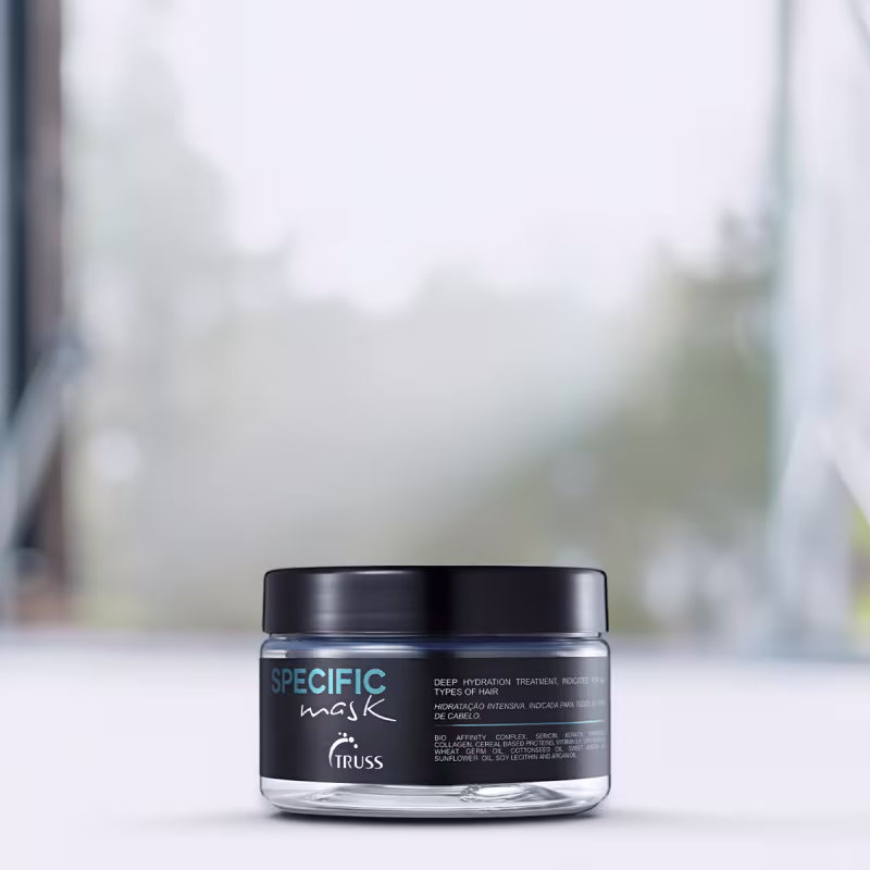 A imagem mostra um pote redondo de máscara capilar.