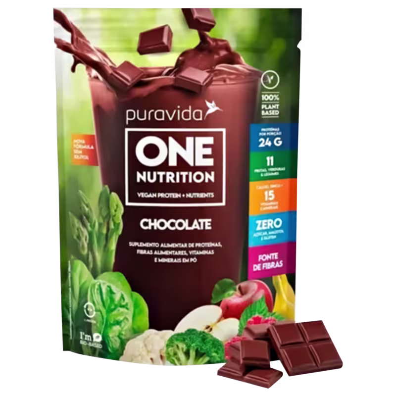Suplemento alimentar vegano de proteína e nutrientes da marca Puravida, sabor chocolate. Destaca que é 100% à base de plantas, contém 24g de proteína, 11 vitaminas e minerais, 15g de fibras e zero açúcares adicionados
