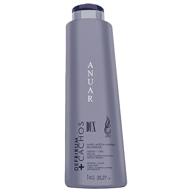Produto de cuidados capilares Anuar, embalagem de frasco plástico cilíndrico cinza. Rótulo com o nome "ANUAR" em letras maiúsculas brancas e a descrição "DEFRISUM + CACHOS DUX" abaixo, indicando um produto para cabelos cacheados ou encaracolados.