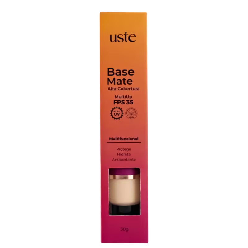 Base Mate em embalagem retangular laranja. Rótulo preto com o nome do produto "Base Mate" e informações como "MultiUp FPS 35", "Multifuncional", "Protege, Hidrata, Antioxidante". Pequena janela mostra o produto a cor bege claro da base.