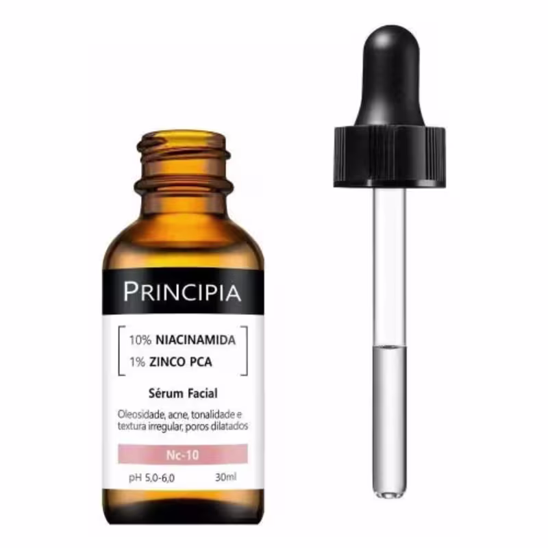 Produto de beleza em frasco conta-gotas âmbar de 30ml. Embalagem plástica preta com rótulo branco indicando "10% NIACINAMIDA 1% ZINCO PCA" e a marca Principia. Conta-gotas preto na parte superior do frasco.
