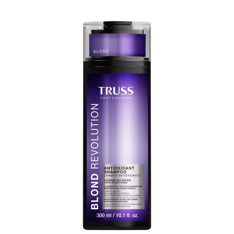 Shampoo antioxidante para cabelos loiros e danificados. Rótulo roxo com o nome do produto "Blond Revolution" em letras brancas. Informações adicionais como "Extreme Bio Repair" e "Antioxidant Shampoo" também estão visíveis no rótulo. Volume de 300ml