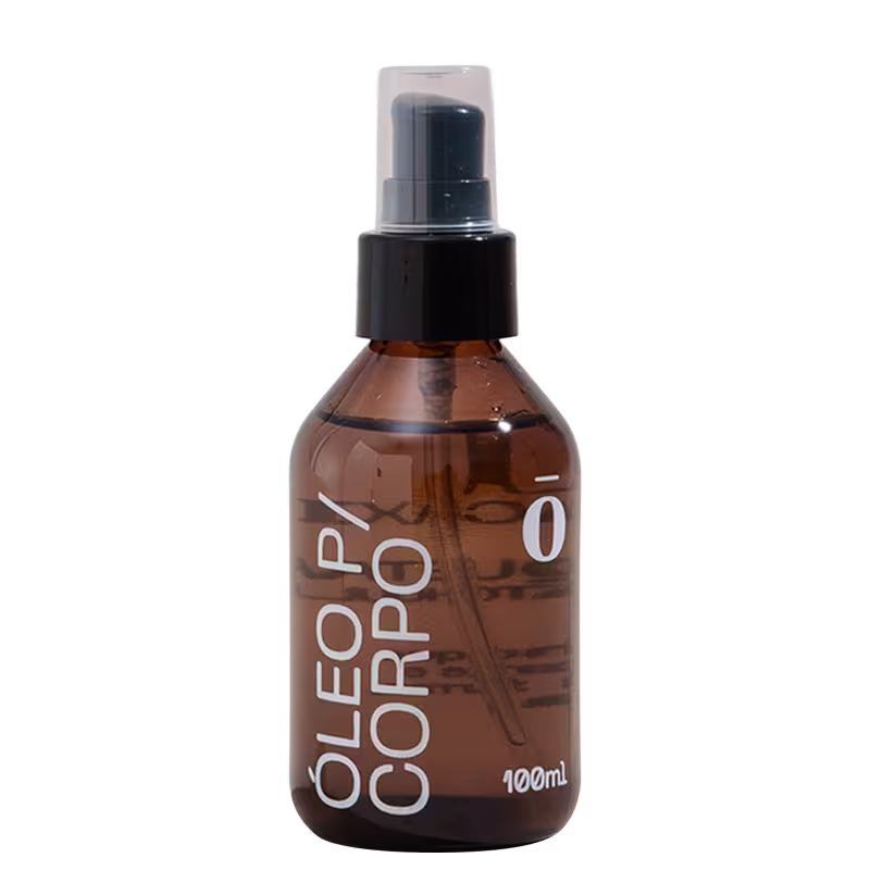 Frasco de spray de 100 ml com rótulo em preto e branco contendo a inscrição "Óleo para Corpo" em destaque.