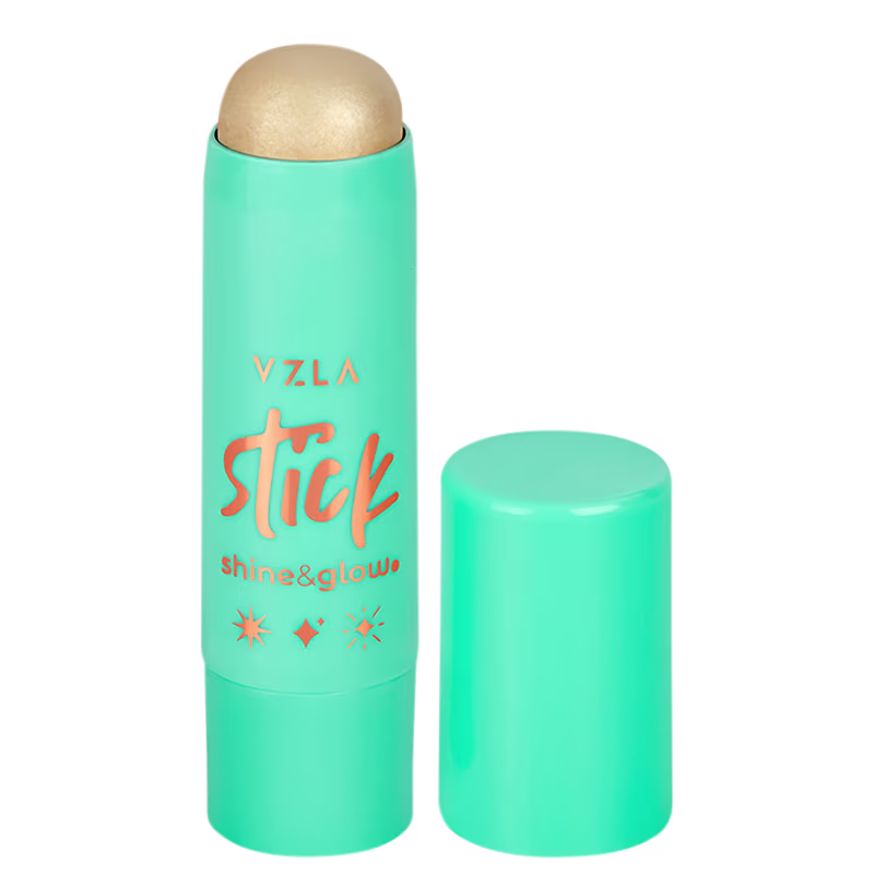 Bastão iluminador compacto da marca Vizzela Cosméticos, com embalagem em tom de verde menta e detalhes em laranja. O produto é descrito como "Shine & Glow" no rótulo.