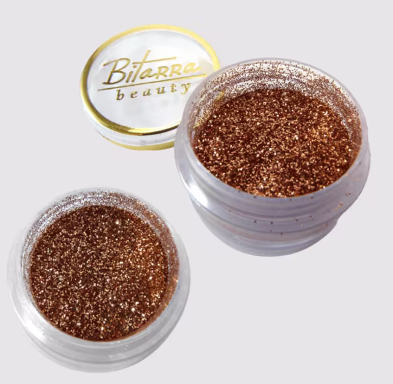 A imagem mostra o produto Sombra Asa de Borboleta Bitarra Beauty na cor GL 16. tom dourado