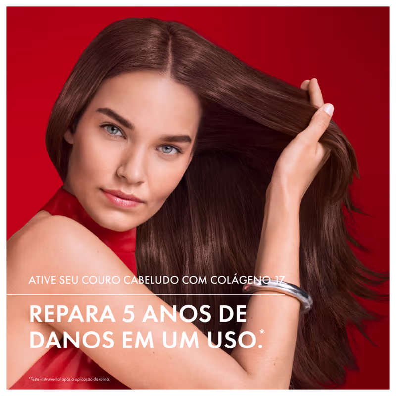 Tubo vermelho de condicionador da marca Dercos Technique, com rótulo indicando "Collagen Repair 17" e "Ultra Reparação". O produto promete fortalecer a estrutura interna dos cabelos danificados.