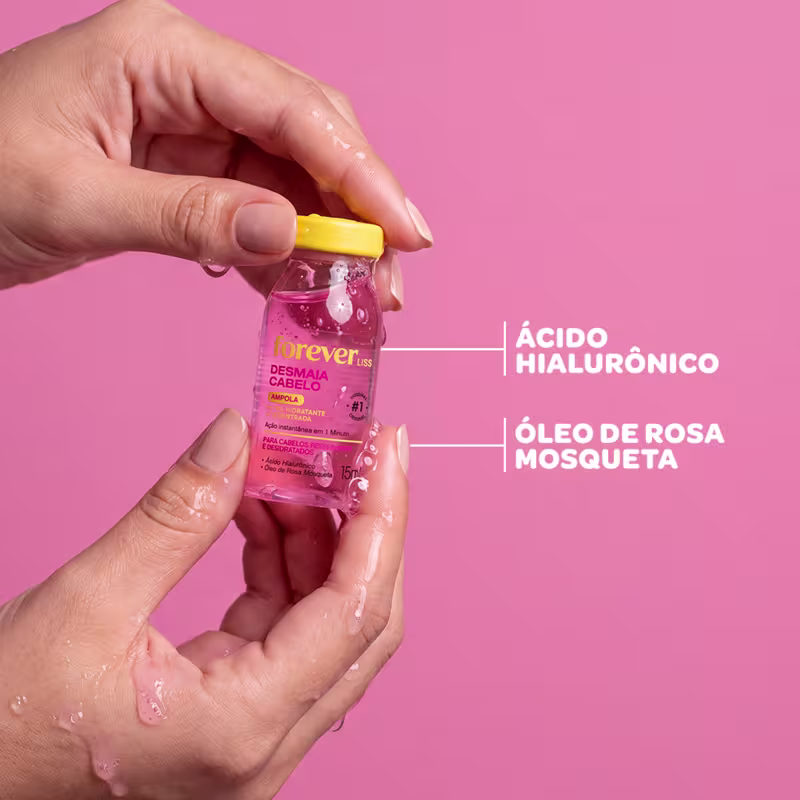 Frasco de 15ml da ampola Desmaia Cabelo da marca Forever Liss, com fórmula para cabelos ressecados e desidratados, contendo ácido hialurônico e óleo de rosa mosqueta, com tampa amarela e rótulo rosa.