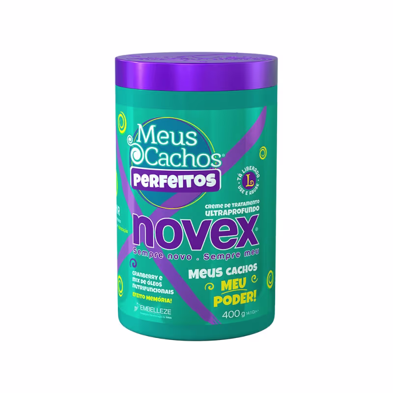 A imagem mostra o Creme de Tratamento Meus Cachos Perfeitos 400g da marca Novex. É uma embalagem cilíndrica com tons de verde e roxo. Destaca ser um produto com cranberry e mix de óleos com efeito memória para os cachos.