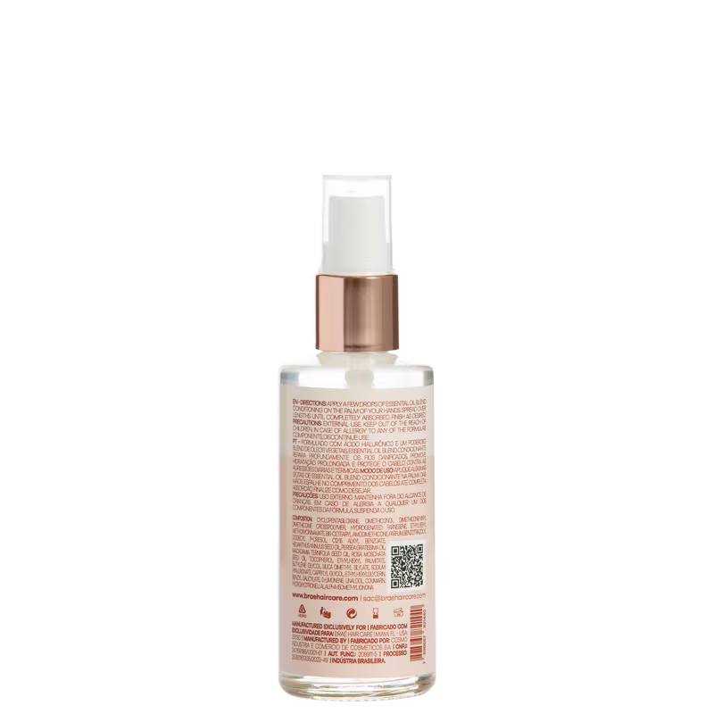 Produto de beleza em frasco plástico transparente com tampa rosada metálica. Embalagem com rótulo contendo texto descritivo em várias línguas, incluindo português, inglês e outros idiomas.