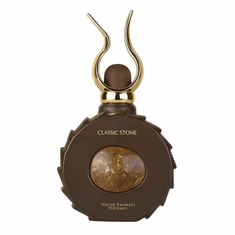Frasco de perfume da linha Classic Stone da Niche Emarati, com formato arredondado e detalhes dourados, exibindo uma pedra central em tom marrom.