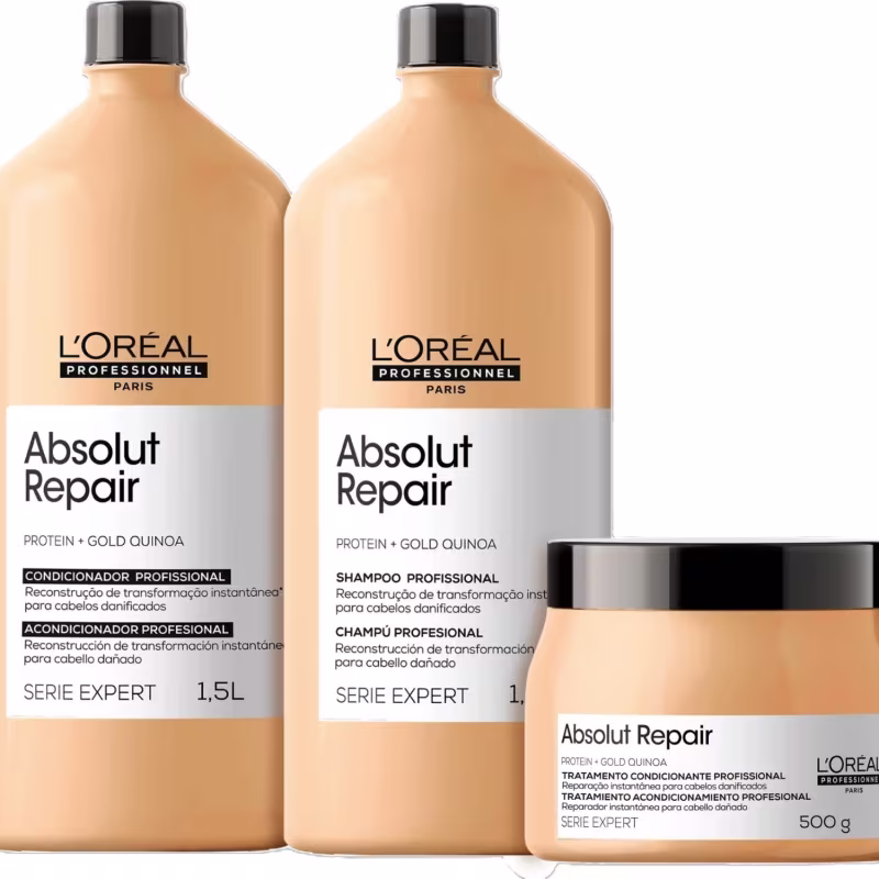 Dois frascos de shampoo e condicionador da linha Absolut Repair da L'Oréal Professionnel, com embalagens em tons de laranja e branco, e um pote de tratamento condicionante da mesma linha, em embalagem branca e preta.