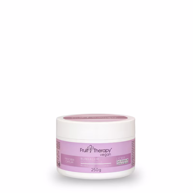 A imagem mostra um frasco branco com rótulo rosa de 250g da máscara da linha Fruit Therapy Vegan Lichia. O design traz cores vivas e informações detalhadas sobre benefícios, composição, certificações veganas e cruelty free.
