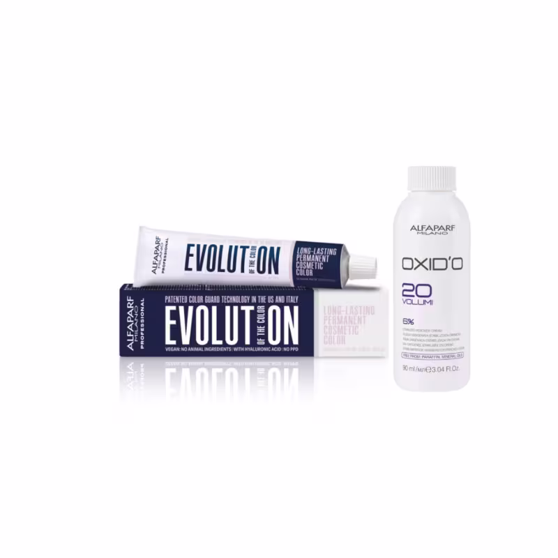Embalagem de tinta de cabelo Alfaparf Milano Evolution, com tubo de creme colorante e frasco de oxidante, em cores predominantes branco e azul escuro. Rótulos indicam tratar-se de uma coloração permanente de longa duração.