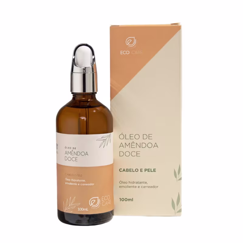 Óleo de amêndoa doce em frasco âmbar de 100ml com tampa cromada. Embalagem retangular em tons de bege e marrom com o logotipo Eco Care e descrições como "óleo hidratante, emoliente e carregador para cabelo e pele". Apresenta ilustrações de folhas.