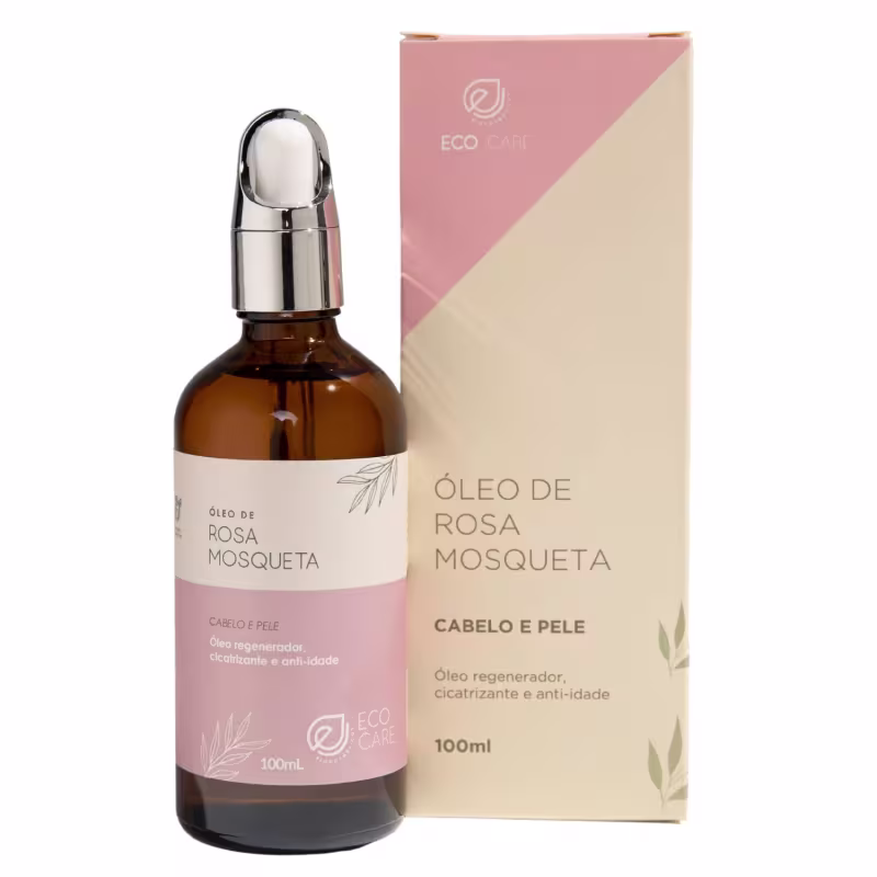 Óleo de rosa mosqueta em frasco de 100ml com conta-gotas cromado. Rótulos descrevem o produto como "Óleo regenerador, cicatrizante e anti-idade para cabelo e pele". Apresentação de cosmético natural com design minimalista e elementos botânicos estilizados