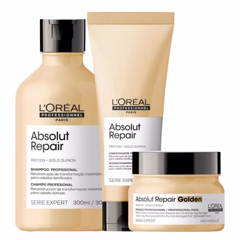 A imagem mostra um kit com 3 produtos da linha Absolut Repair de L'Oréal. Sendo, um frasco cilíndrico de shampoo, um frasco tubular de condicionador e um pote redondo de máscara. Todos na cor amarela.