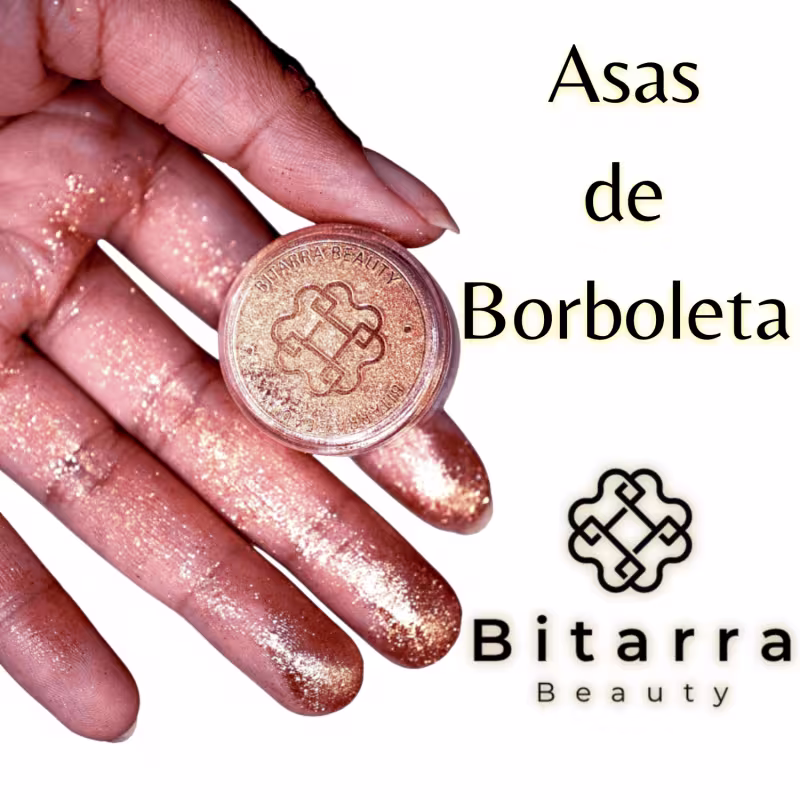 Produto de beleza Bitarra Beauty em embalagem redonda dourada com logotipo, contendo pó brilhante em tons rosados. Texto "Asas de Borboleta" e "Bitarra Beauty" visível na imagem.