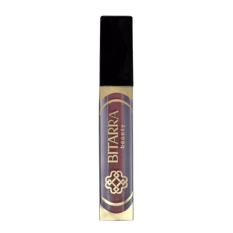 Batom líquido da marca Bitarra Beauty em embalagem preta e dourada, com rótulo destacando o nome da marca em letras douradas.