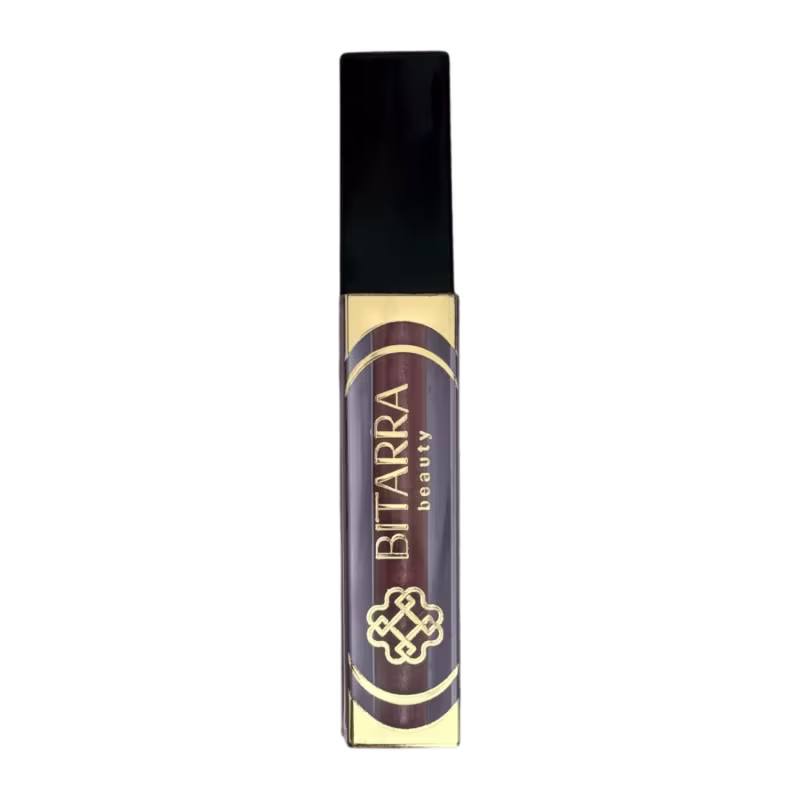 Batom líquido da marca Bitarra Beauty em embalagem preta e dourada, com rótulo destacando o nome da marca em letras douradas.