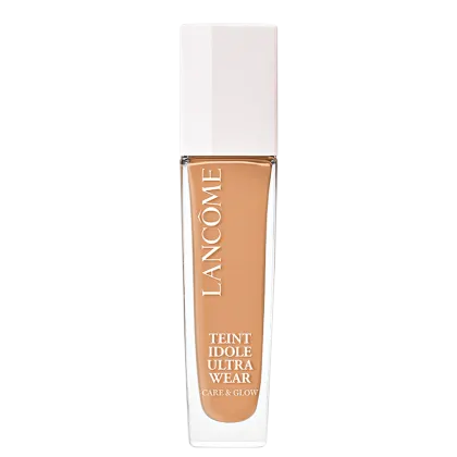 Frasco de maquiagem Lancôme Teint Idole Ultra Wear, com embalagem branca e detalhes dourados, contendo um produto de base líquida com acabamento natural e efeito de luminosidade.