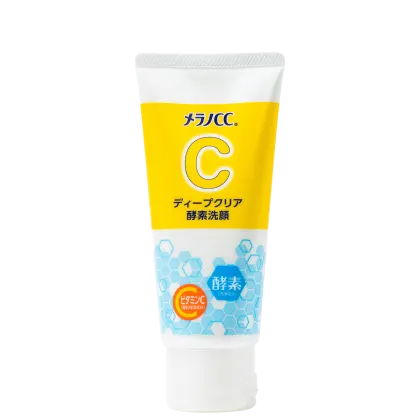 Tubo de produto de limpeza facial da marca Melano CC, com embalagem branca e amarela destacando o ingrediente vitamina C. O rótulo apresenta informações sobre o produto em japonês.