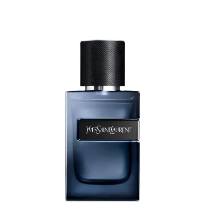 Frasco de perfume Yves Saint Laurent em tom azul escuro com rótulo preto destacado. Embalagem cilíndrica com tampa preta e textura de fibra de carbono. Produto de beleza da marca de luxo francesa.