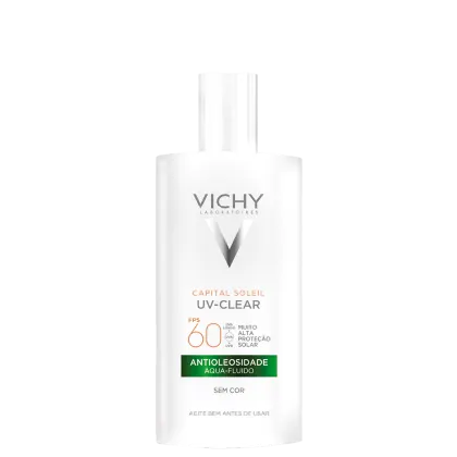 Embalagem em frasco plástico branco opaco. Rótulo frontal com o logotipo Vichy e o nome do produto "Capital Soleil UV-Clear" em letras cinza. Indicação de FPS 60 e descrição "Antioleosidade Aqua-Fluido Sem Cor".