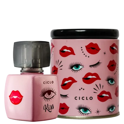 Perfume em frasco de vidro rosa com tampa preta. Ao lado, uma lata cilíndrica rosa com padrão de olhos maquiados e lábios vermelhos espalhados. O nome "Ciclo" está impresso em ambas as embalagens.