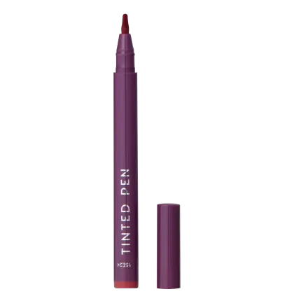 A imagem mostra a caneta batom Tinted Pen da Océane, em embalagem plástica roxa em formato de caneta. O nome "Tinted Pen" está impresso em letras brancas na lateral da embalagem.
