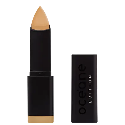 A imagem mostra a Base em Bastão Océane Edition Foundation Stick aberta e com a tampa do lado. Possui embalagem preta fosca com o logotipo "Océane Edition" impresso em letras brancas e pretas. A ponta da base tem formato triangular.