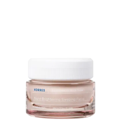 A imagem mostra um creme facial noturno em um frasco transparente de plástico com tampa branca, contendo um creme gel rosado.