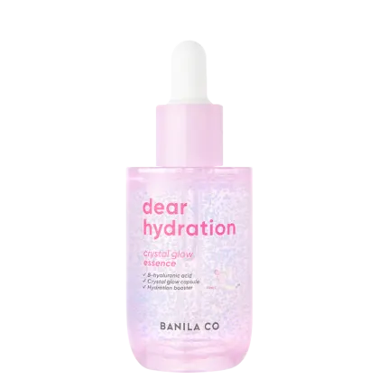 Essência hidratante com brilho cristalino em frasco plástico transparente com tampa conta-gotas. Embalagem rosa clara e lista de ingredientes principais: ácido hialurônico, cápsulas de brilho cristalino e potencializador de hidratação.