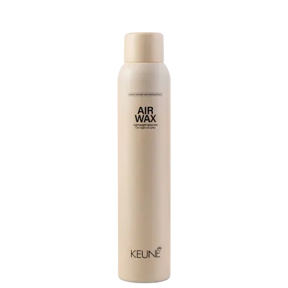A imagem mostra a cera em spray Style Air Wax da marca Keune. Embalagem em forma de lata aerossol cilíndrica na cor bege claro.