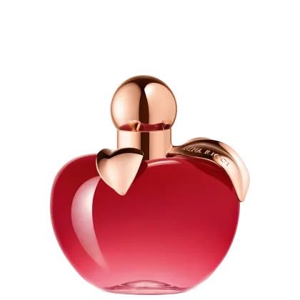 Frasco de perfume em formato de maça, com tampa dourada, em cor vermelha brilhante. Rótulo com nome da marca "Nina Ricci" visível.