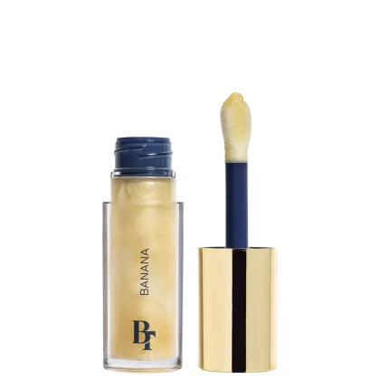 Gloss Labial de Bruna Tavares BT Banana Jelly Oil, com 6ml, em embalagem transparente, interior com detalhes em azul e tampa dourada. 