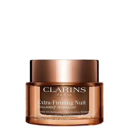 Pote de creme facial da marca Clarins, com tampa dourada, rótulo com texto "Extra-Firming Nuit" em preto e branco, em embalagem de vidro com acabamento metálico.