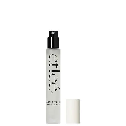 Frasco de perfume Etleé com nome da marca e do perfume "Toasted Vanilla Eau de Parfum" em fonte elegante. Embalagem compacta e moderna, com bico pulverizador.