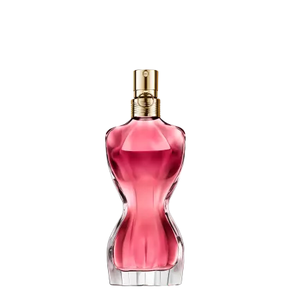Frasco de perfume Jean Paul Gaultier com formato curvilíneo e tampa dourada. O frasco exibe uma silhueta feminina, destacada por um detalhe floral dourado e um toque granada, preenchido com um radiante líquido rosa-alaranjado.