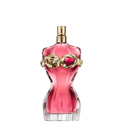 Frasco de perfume Jean Paul Gaultier com formato curvilíneo e tampa dourada. O frasco exibe uma silhueta feminina, destacada por um detalhe floral dourado e um toque granada, preenchido com um radiante líquido rosa-alaranjado.