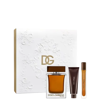 Caixa branca com detalhes florais em relevo, contendo um frasco de perfume Dolce & Gabbana The One, acompanhado de um tubo de shower gel e um frasco menor, em embalagem de presente.