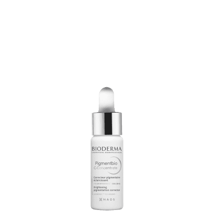 Frasco de vidro branco com conta-gotas da linha Pigmentbio da Bioderma, contendo um concentrado para correção de pigmentação. Rótulo com texto em inglês e francês indicando o nome do produto e sua função de clareamento.