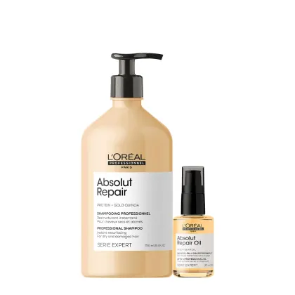 O produto de beleza apresentado é um conjunto da linha Absolut Repair da L'Oréal Professionnel, composto por um frasco de shampoo de 750 ml e um frasco de óleo reparador de 30 ml, ambos com embalagens em tons de bege e preto.